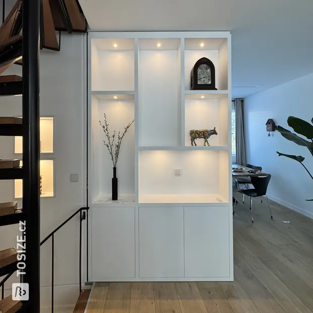 White wall unit with open compartments and doors