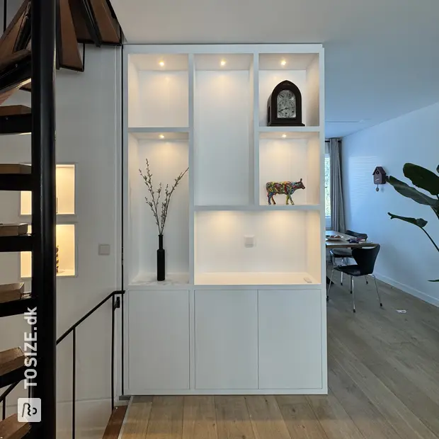 White wall unit with open compartments and doors
