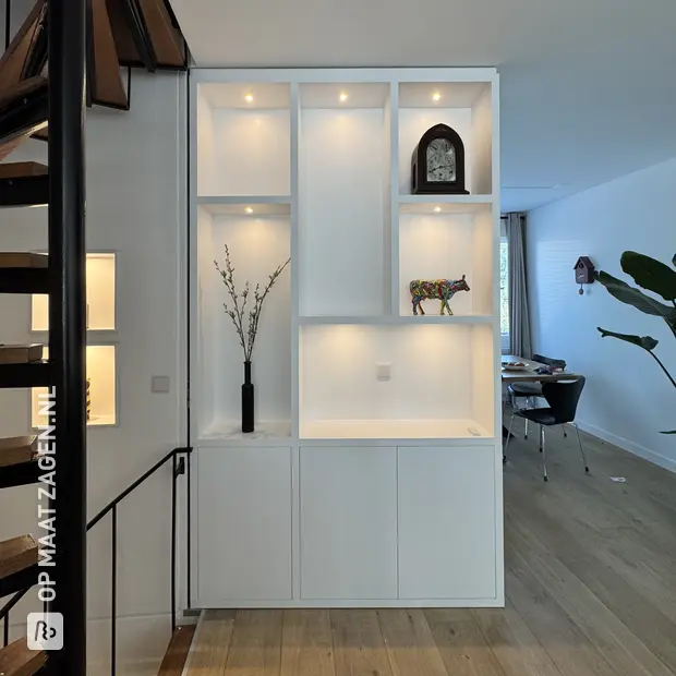 White wall unit with open compartments and doors