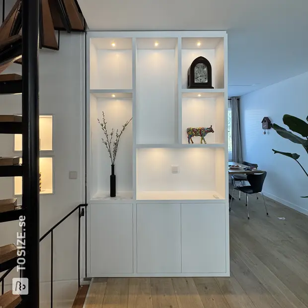 White wall unit with open compartments and doors