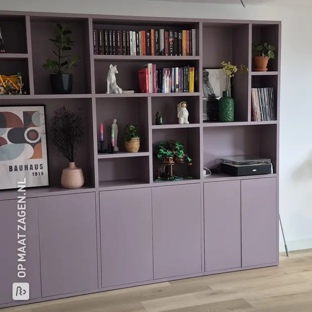 Lilac wall unit with open compartments and doors
