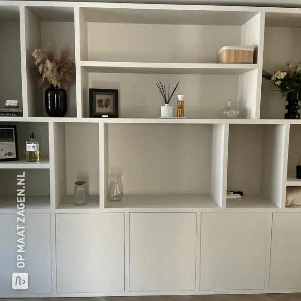 White compartment cabinet with open compartments and doors