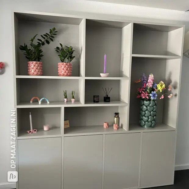 Grey wall unit with open compartments and doors