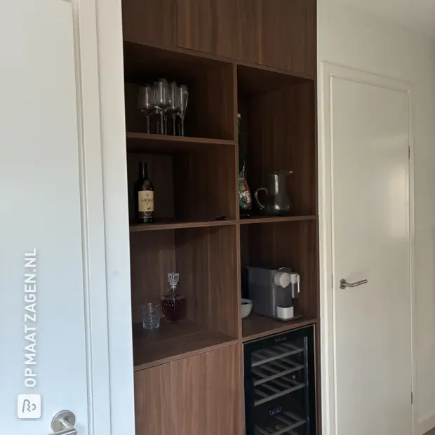 Dark wooden sideboard with open compartments and doors