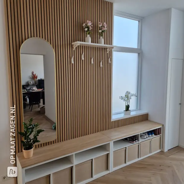 Light wood sideboard with doors and open compartments