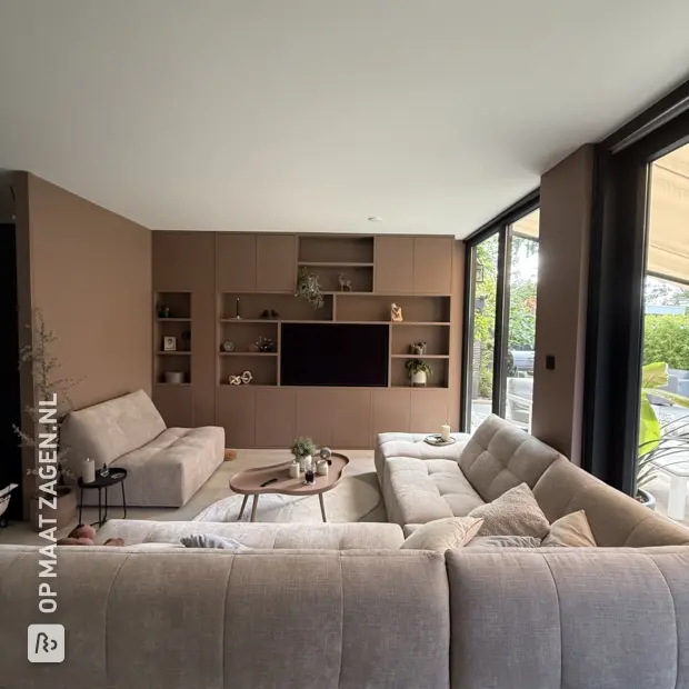 Brown wall unit with open compartments and doors