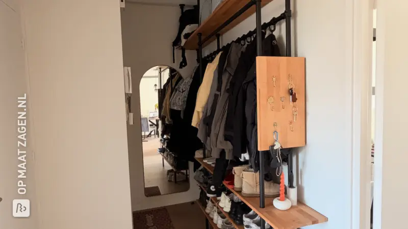 Stylish wooden hallway closet with coat rack and shoe shelves, by Romy