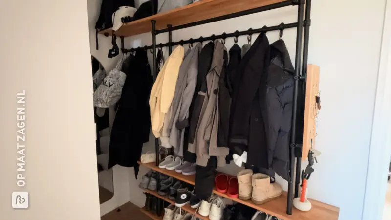 Stylish wooden hallway closet with coat rack and shoe shelves, by Romy