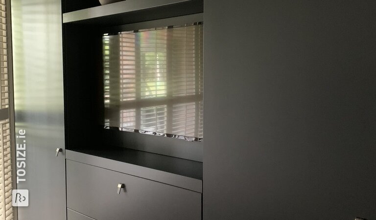 Super sleek TV wall cabinet in bedroom, by Paul