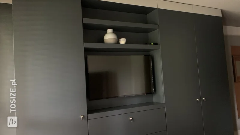 Super sleek TV wall cabinet in bedroom, by Paul