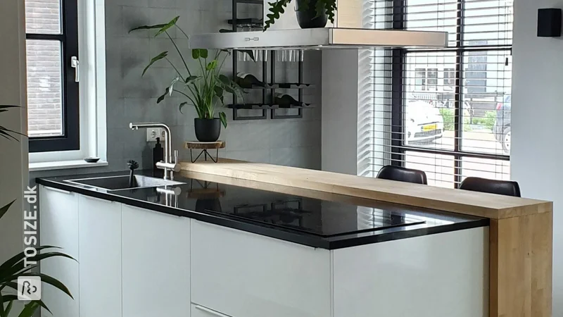 Oak bar adjacent to kitchen island, by Denise