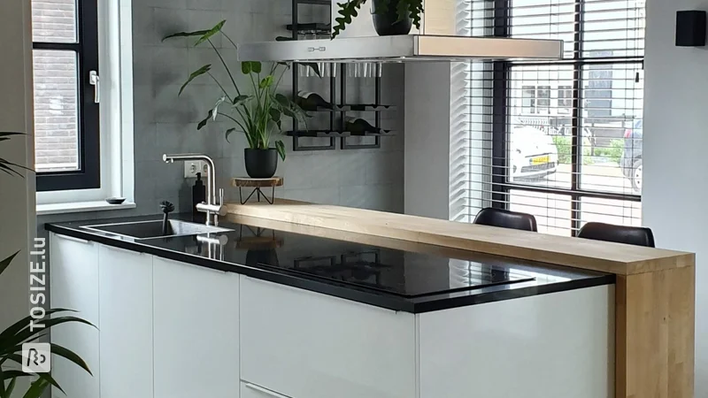 Oak bar adjacent to kitchen island, by Denise