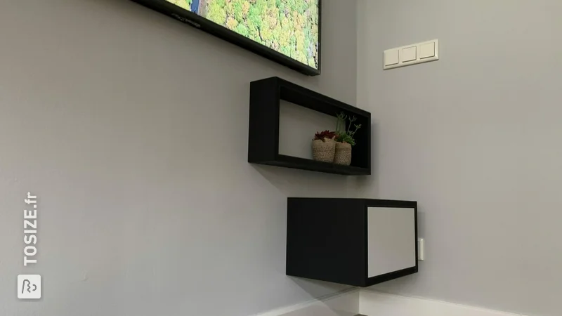 Minimalist TV cabinet made of black MDF, by Kirstin