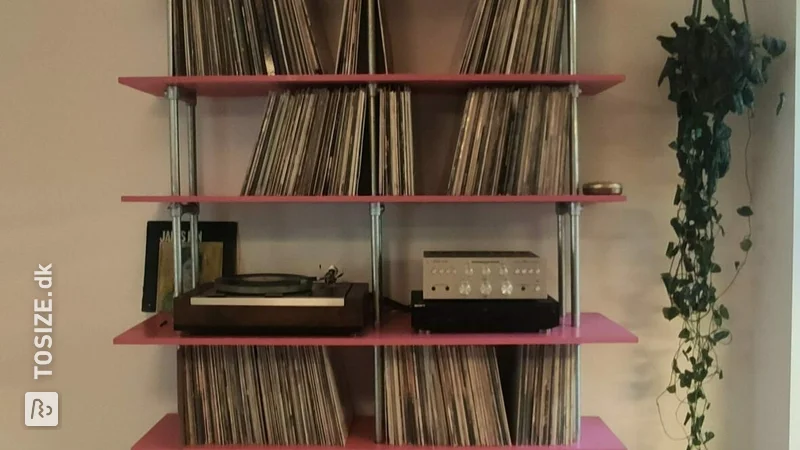 Record cabinet made of scaffolding pipes and pine carpentry panel, by Andreo