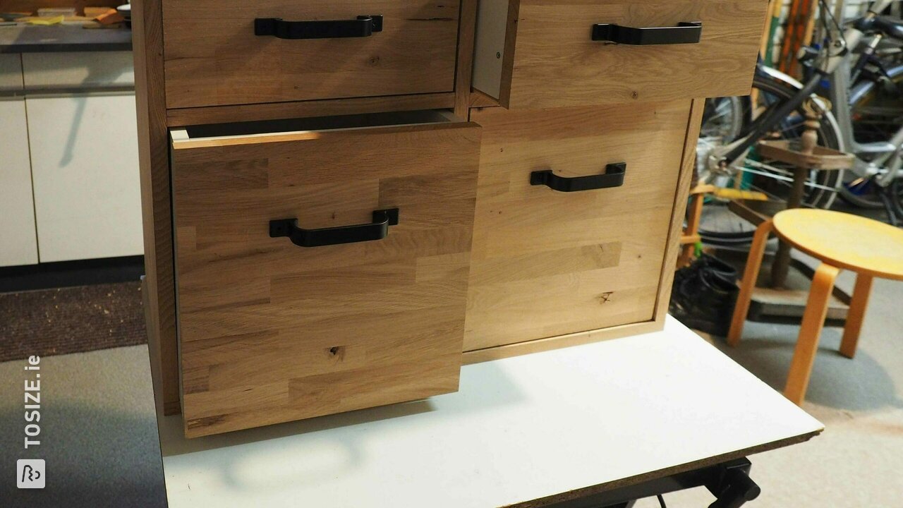 Hanging chest of drawers in rustic oak, by Hans