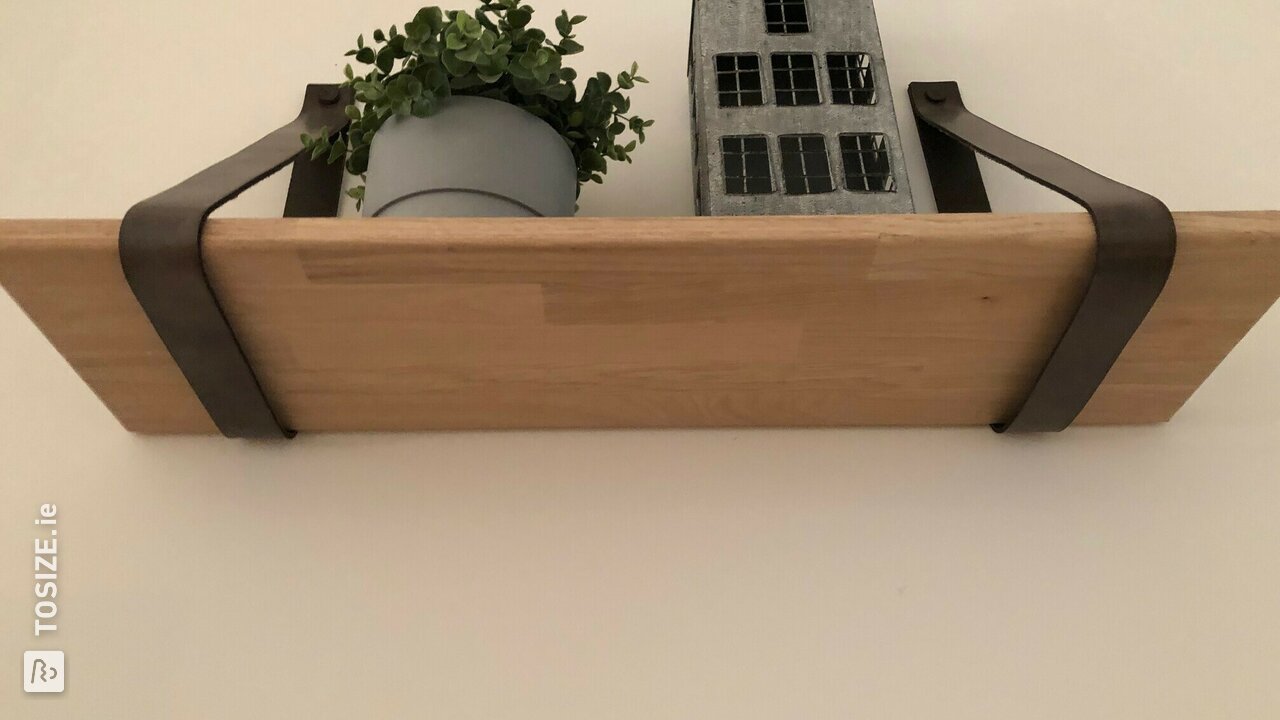 Solid oak wall shelf with leather supports, by Stefan