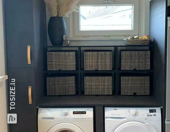 Storage cabinets for the laundry room made of black MDF