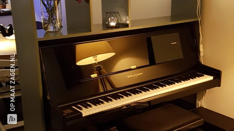 Room divider around a piano made of MDF, by Koos