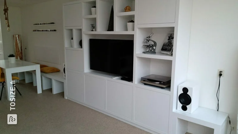 Compartment cupboard with TV niche and sofa, by Erik