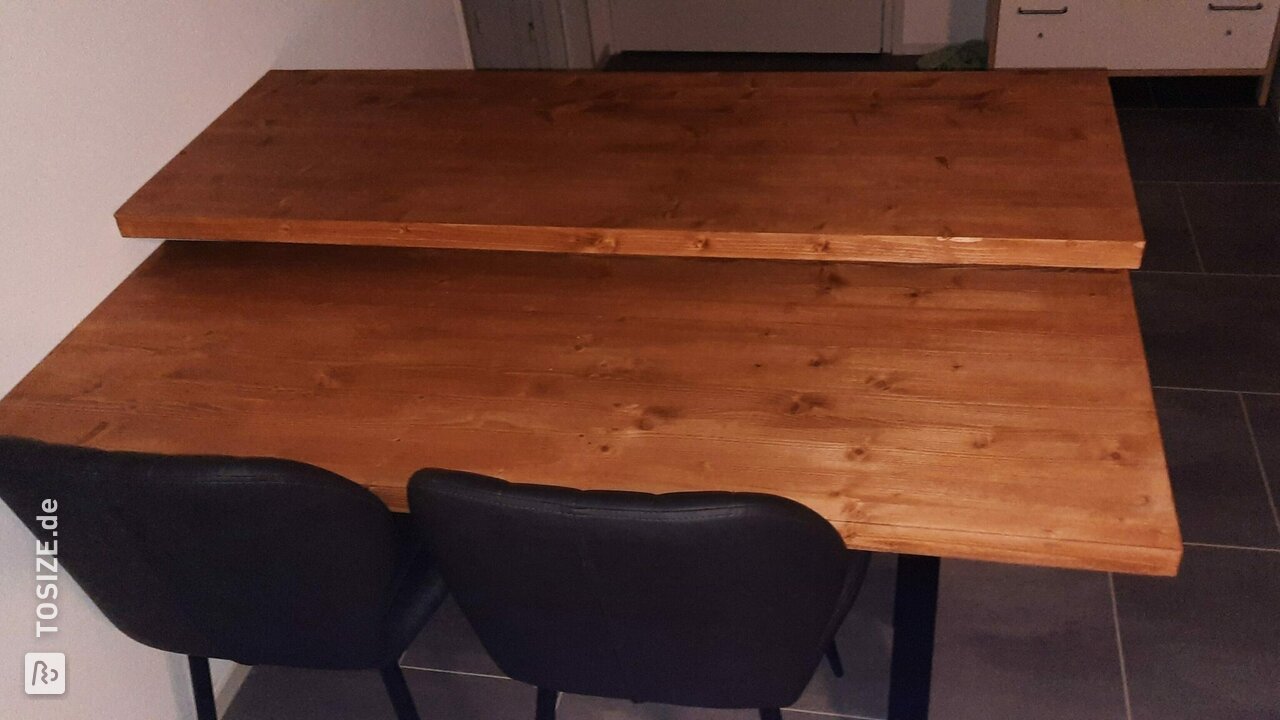 Dining table made of 40 mm spruce timber panel with raised top for wheelchair user
