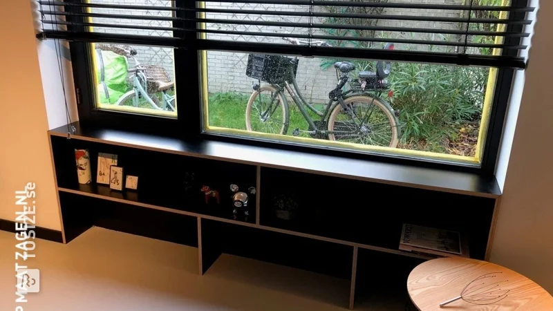 A windowsill with a bookcase