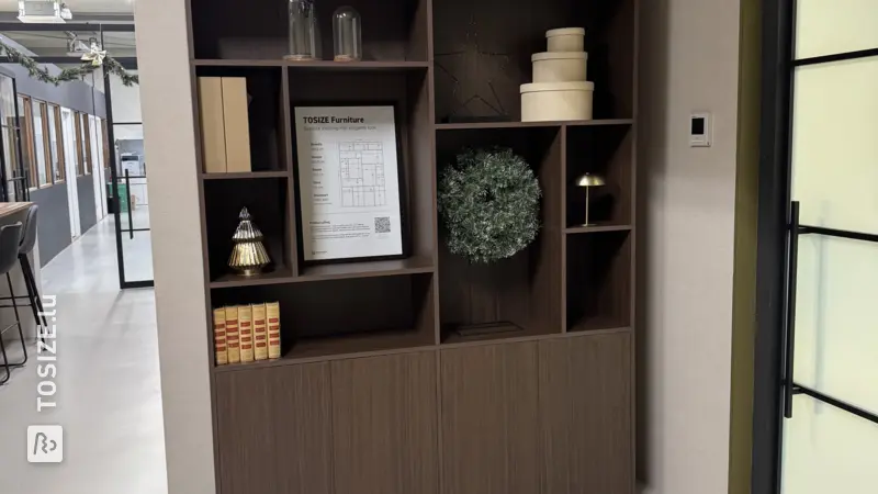 Playful display cabinet with large and small compartments in brown oak, by Laurie