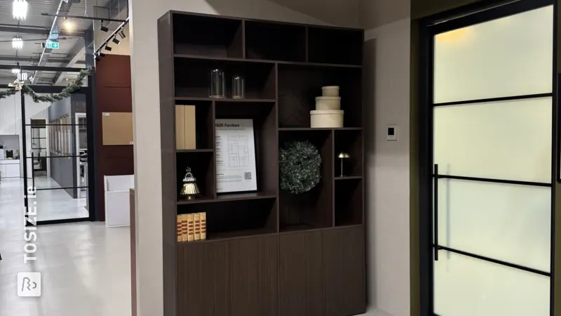 Playful display cabinet with large and small compartments in brown oak, by Laurie