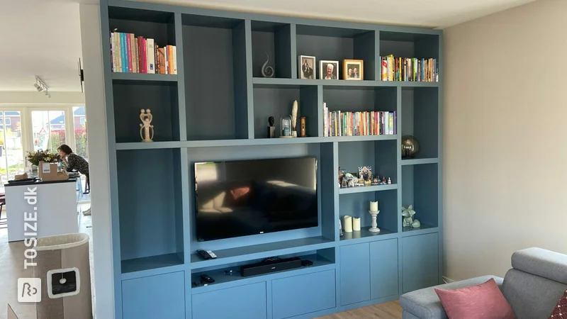 Wall unit made of MDF in a sleek sea-blue color, by Gertjan