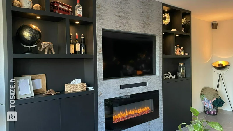 Black oak wall cabinet with TV soffit, by Melissa