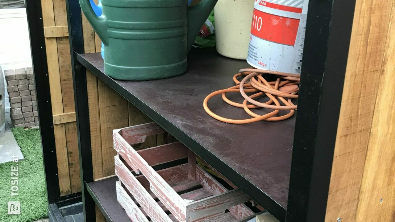 Cottage with concreteplex shelves for garden tools, by Ben