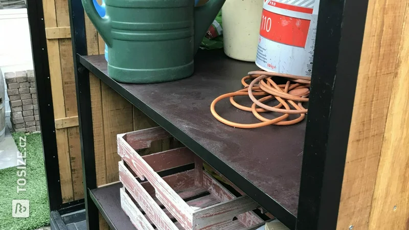 House with concrete plywood shelves for garden tools, by Ben