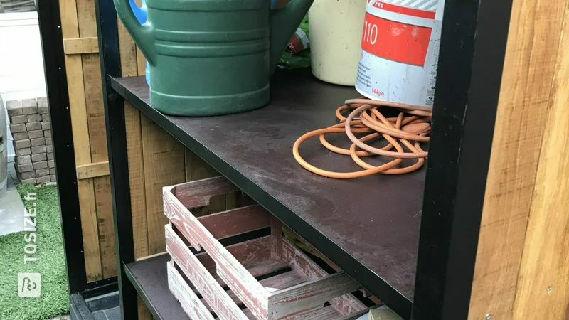 House with concrete plywood shelves for garden tools, by Ben