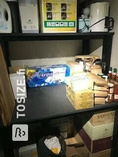 Spacious cupboard shelves in the basement made of black MDF, by Pieter