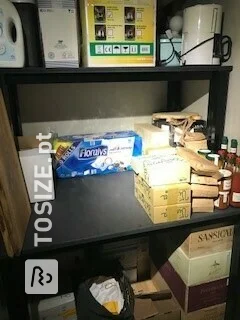 Spacious cupboard shelves in the basement made of black MDF, by Pieter