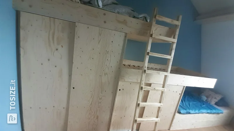 Bunk beds with cupboard space, by Jan