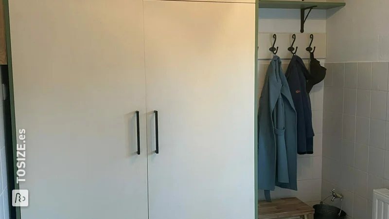 Washing machine cupboard and coat rack in the hall, by Irene