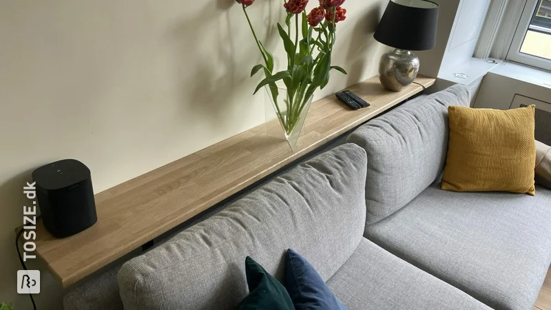 Homemade bar, rack above the sofa and table, by Joost