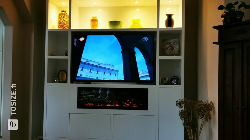 TV cabinet with decorative fireplace from MDF Lakdrager, by Kees