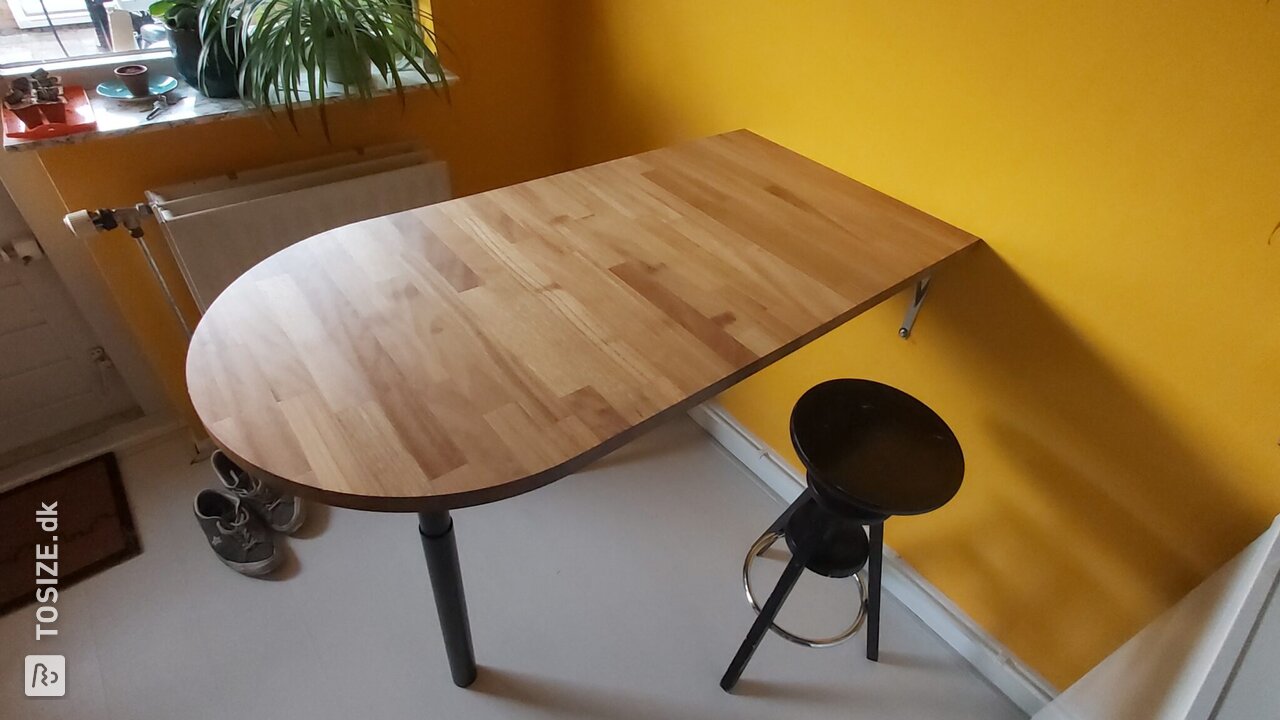 Solid Iroko bar table in unique shape, by Roy