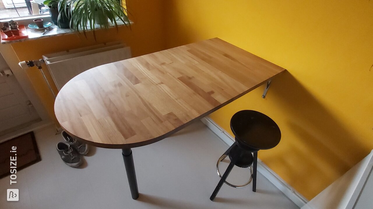 Solid Iroko bar table in unique shape, by Roy