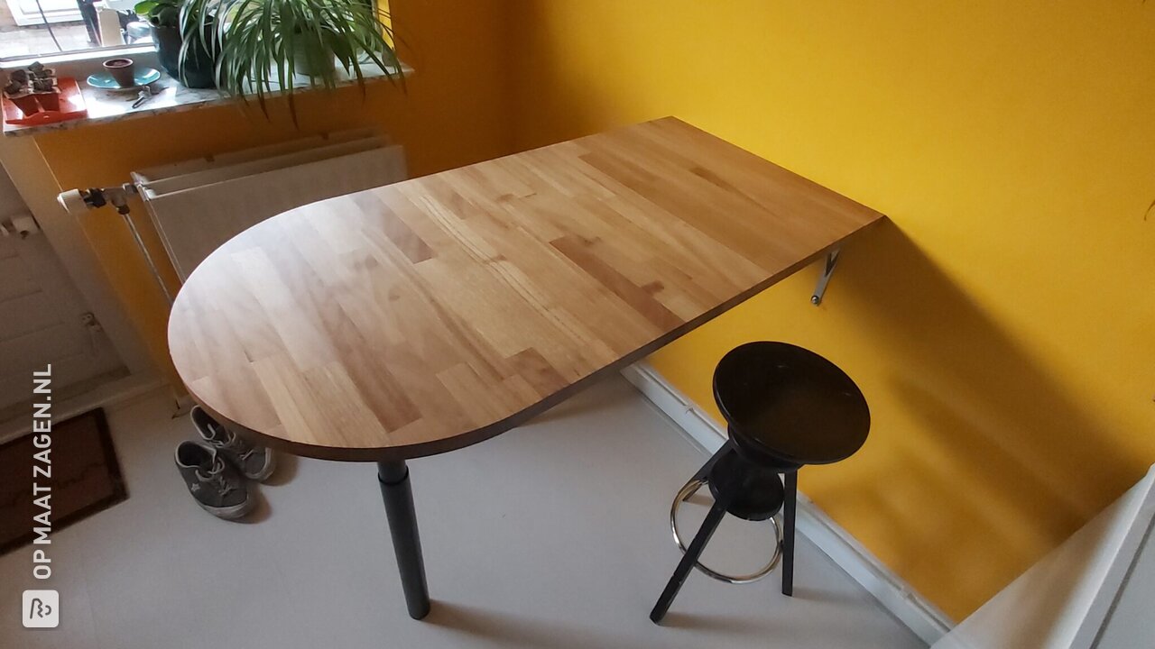 Solid Iroko bar table in unique shape, by Roy