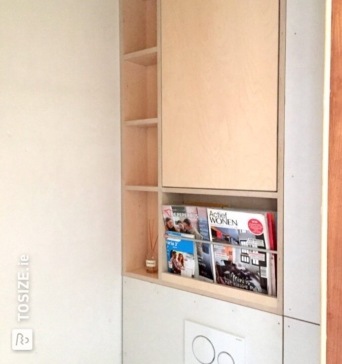 Storage cupboard made of birch plywood in the toilet area