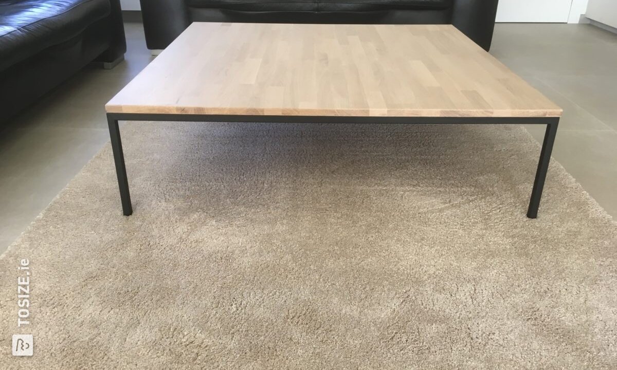 Coffee table with an oak top and matte black legs
