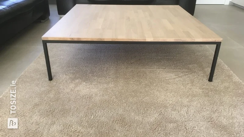 Coffee table with an oak top and matte black legs