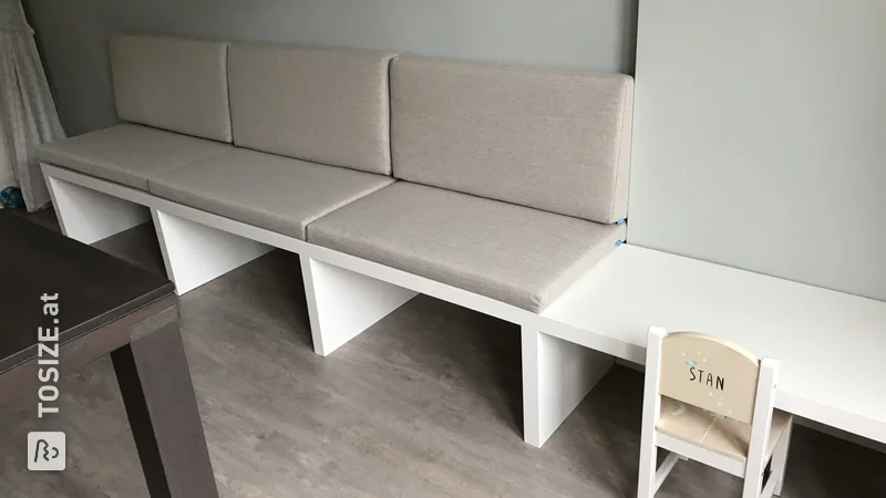 Dining table sofa with adjacent children's desk, by Paula