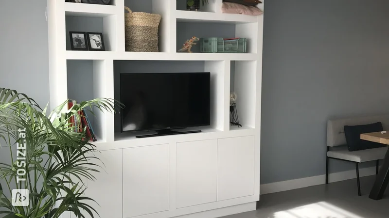 A TV compartment cabinet precisely tailored, by Ineke