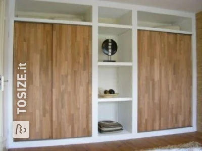 Built-in wardrobe with custom oak doors, by Bram