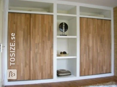 Built-in wardrobe with custom oak doors, by Bram