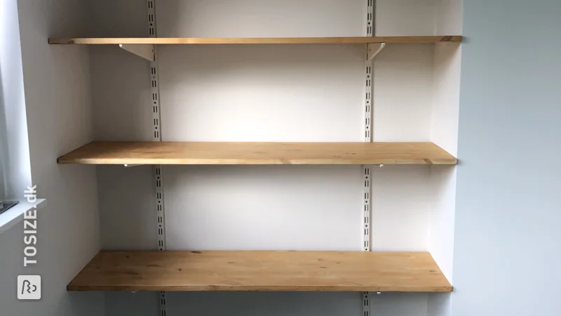 A custom built-in cupboard for the attic made of pine planks, by Lisette