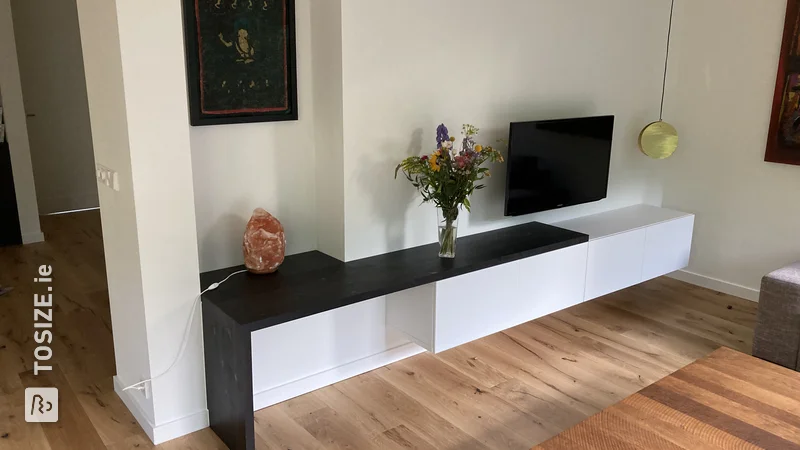 IKEA BESTA hack: custom extension of TV cabinet with dark panels, by Willem